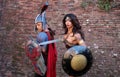 Cosplayer couple dressed as Thor and Wonder Woman, characters from the DC Comics universe at the Lucca Comics and Games 2022.