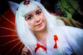 Cosplayer dressed as `Amaterasu` from the video game `Okami` Royalty Free Stock Photo