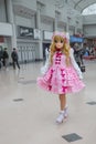 A cosplayer dressed as a baby doll Lycoris Anime character