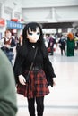 A cosplayer dressed as a Lycoris Anime character with mask