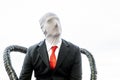 Cosplayer with red tie and anonymous face