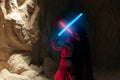 Cosplayers portray lightsaber combat between characters enemies Rey Skywalker and Kylo Ren from the Star Wars universe among Royalty Free Stock Photo