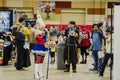 Cosplayers posing and performing for fans and photographers at the Comic Expo