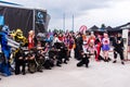 Cosplayers posing for photographers and press