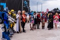 Cosplayers posing for photographers and press