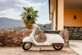 Old white Italian scooter in the center of the village of Cossogno Royalty Free Stock Photo