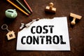 Cost Control concept. Office items on a rusty metal background Royalty Free Stock Photo