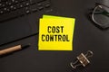 Cost Control Concept . torn paper from a notebook against Royalty Free Stock Photo