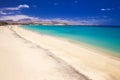 Costa Calma sandy beach with vulcanic mountains on Jandia peninsula, Fuerteventura island, Canary Islands, Spain.