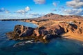 Costa de Papagayo on a sunny evening. The mountain range Los Ajaches in the background. Lanzarote, Spain