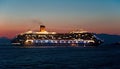 Costa Fascinosa cruise ship arrives at night at Mykonos, Greece. Royalty Free Stock Photo