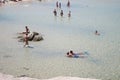 Costa Rei, Italy - August 25: Unidentified people in beach called Scoglio di Peppino. Sunny day in summertime, crystal water like Royalty Free Stock Photo