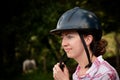 Costa Rican tourist putting on equestrian helmet Royalty Free Stock Photo
