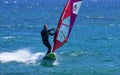 Windsurfer moving at speed on the ocean. Royalty Free Stock Photo