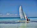 Costa Verde, Guardalavaca, Cuba - January 12, 2014 - Family boarding a catamaran sailboat