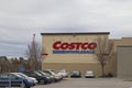 Costco retail superstore building sign and parked cars distant view