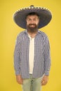 Costume accesory. Bearded man in mexican hat. Mexican man wearing sombrero. Hipster in wide brim hat. Traditional Royalty Free Stock Photo