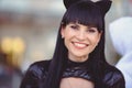 Costume of a beautiful young model wearing a cat costume. Hot sexy brunette cat-style female black fetish latex leather cat.