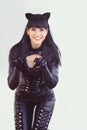 Costume of a beautiful young model wearing a cat costume. Hot sexy brunette cat-style female black fetish latex leather cat. Royalty Free Stock Photo