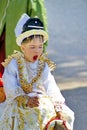 Costumed child on a horse in a parade in Myanmar