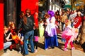Costumed children and their parents trick or treat through a downtown district on a sunny Halloween day Royalty Free Stock Photo