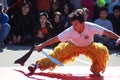 A costumed dancer with a sword