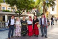 Costumed group of people at a folk festival.