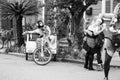 A Costumed Person Lounges on a Bike Taxi on Mardi Gras Day Royalty Free Stock Photo