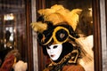 Costumed woman near the Piazza San Marco during Venice Carnival