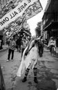 Costumed Woman Waves a Flag on Mardi Gras Day in the French Quarter