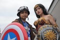 Costumers roleplaying Captain America and Wonder woman Royalty Free Stock Photo