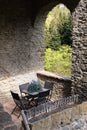 Cosy balcony with table in the old medieval stone house, Rupit, Catalonia, Spain