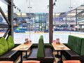 Cosy cafe interior with soft furnishings overlooking the Ice Arena in AKROPOLE shopping mall, Riga