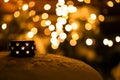 A candle on the snow in the night with boche background. Royalty Free Stock Photo