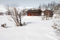 a cosy hut of hunters in a winter landscape in the mountains of Jotunheim in Norway