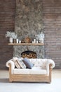 Cosy living room with eco decor. Wood and nature concept in interior of room. Scandinavian interior. Hygge decoration.  Cozy ston Royalty Free Stock Photo