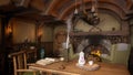 Cosy living room in a small medieval fantasy cottage style home for halflings or dwarves. 3D rendering Royalty Free Stock Photo