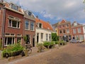 Cosy street with typical Dutch houses with potted plants in a street in Utrecht, the NEtherlands