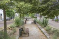 A cosy village square with benches and trees in the picturesque village of Drimmelen, Netherlands Royalty Free Stock Photo