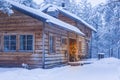 Cosy Wooden House with Christmas Tree in Front Located in Tranquil Picturesque Nordic Forest