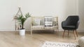 Cot bed and modern gray chair in baby bedroom