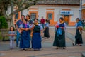 COTACACHI, ECUADOR, NOVEMBER 06, 2018: Unidentified people walking in the sidewak, of the city of Cotacachi Royalty Free Stock Photo