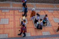 COTACACHI, ECUADOR, NOVEMBER 06, 2018: Unidentified people walking in the sidewak, of the city of Cotacachi Royalty Free Stock Photo