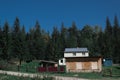 Cotage and the beautiful scenic forests on sky background in Carpathian Mountains, Ukraine