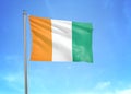 Cote d\'Ivoire flag waving sky background 3D illustration