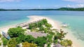 Cotivas Island Cottage. Tropical island with palm trees and a white sandy beach. Caramoan Islands, Philippines Royalty Free Stock Photo