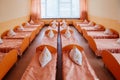 Cots in the kindergarten. Orphanage or boarding school. Beds in a boarding school or in an orphanage Royalty Free Stock Photo
