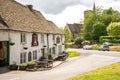 The Cotswold village of Uley with the Old Crown country pub and The Church of Saint Giles, Cotswolds, England