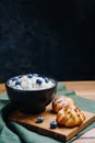 Cottage Cheese In Bowl. Homemade Curd Cheese Served With currant berries or blueberry. Healthy breakfast concept. Royalty Free Stock Photo