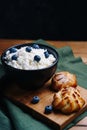 Cottage Cheese In Bowl. Homemade Curd Cheese Served With currant berries or blueberry. Healthy breakfast concept. Royalty Free Stock Photo